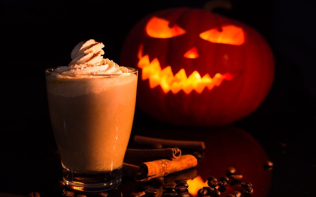 Spooky pumpkin next to Halloween drink